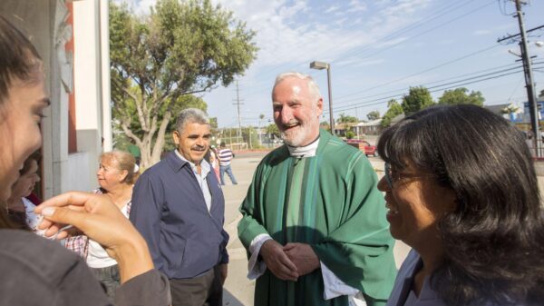 Los Angeles Auxiliary Bishop David G. O'Connell is pictured speaking with parishioners outside St. Frances X. Cabrini Church in Los Angeles July 19, 2015. According to local news reports, Los Angeles County sheriffs found him dead of a gunshot wound at his home Feb. 18, 2023, and his death has been ruled a homicide. An investigation was under way for a suspect and motive. A native of Ireland, he spent most of his four decades as a priest ministering in the inner city of Los Angeles. He was 69. Editors: This cutline has been updated to reflect new details about the bishop's death. (OSV News photo/CNS file, John Rueda, The Tidings)