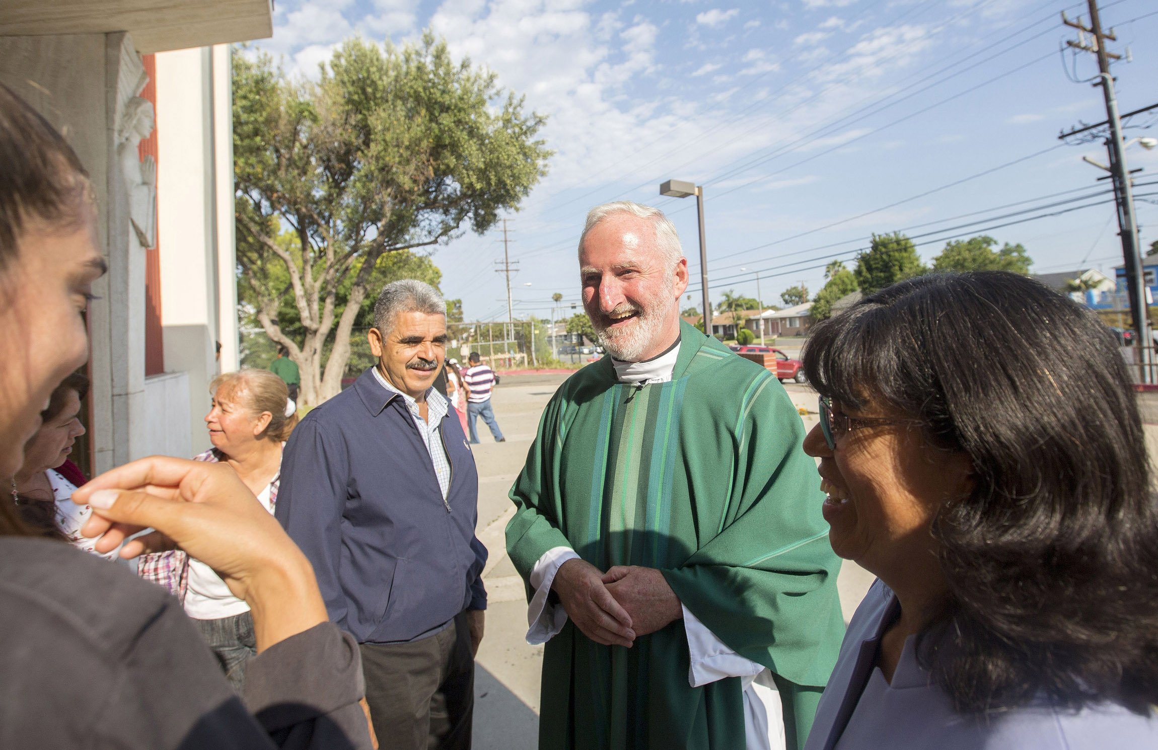 Los Angeles Auxiliary Bishop David G. O'Connell is pictured speaking with parishioners outside St. Frances X. Cabrini Church in Los Angeles July 19, 2015. According to local news reports, Los Angeles County sheriffs found him dead of a gunshot wound at his home Feb. 18, 2023, and his death has been ruled a homicide. An investigation was under way for a suspect and motive. A native of Ireland, he spent most of his four decades as a priest ministering in the inner city of Los Angeles. He was 69. Editors: This cutline has been updated to reflect new details about the bishop's death. (OSV News photo/CNS file, John Rueda, The Tidings)