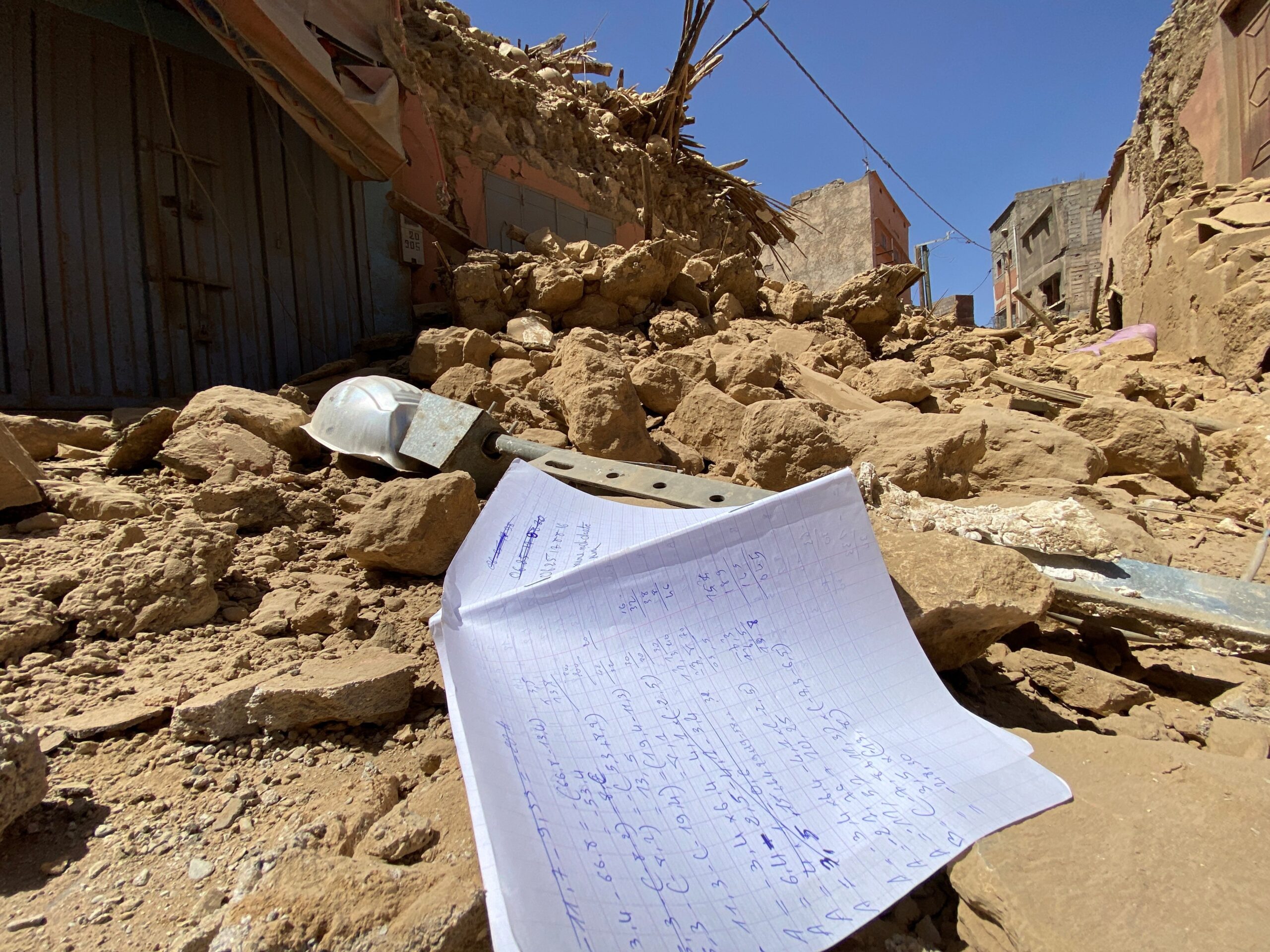 A notebook is seen Sept. 9, 2023, amid the rubble in Amizmiz, Morocco, in the aftermath of the deadliest earthquake to hit the country in decades, killing at least 2,000 people. The U.S. Geological Survey recorded a magnitude 6.8 quake at 11:11 p.m. (local time) Sept. 8, while Morocco's seismic monitoring agency measured it at magnitude 7. (OSV News photo/Abdelhak Balhaki, Reuters)
