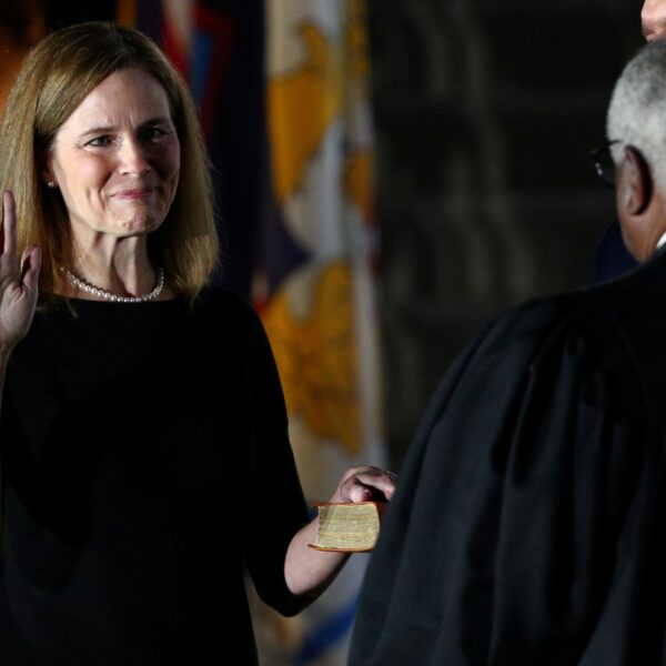 Judge Amy Coney Barrett holds her hand on the Bible as she is sworn in as an associate justice of the U.S. Supreme Court by Supreme Court Justice Clarence Thomas at the White House in Washington Oct. 26, 2020. Barrett spoke Sept. 21, 2023, at The Catholic University of America's Columbus School of Law. (OSV News photo/Tom Brenner, Reuters)
