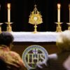 CARA report on the Eucharist: People gather for Eucharistic adoration in this file photo from May 2006. (OSV News photo/Greg Tarczynski)
