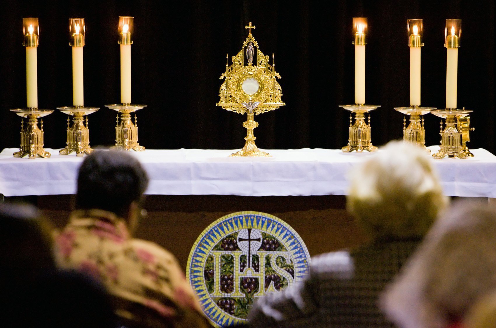 CARA report on the Eucharist: People gather for Eucharistic adoration in this file photo from May 2006. (OSV News photo/Greg Tarczynski)
