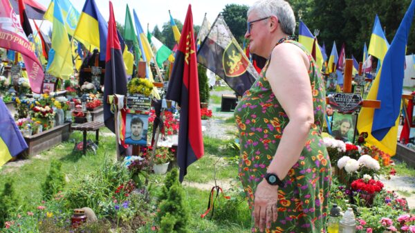 Ukrainian iconographer and artist Ivanka Krypyakevych-Dymyd, seen June 23, 2023, tends the grave of her son, Artem, who was killed in June 2022 while defending Ukraine and was laid to rest in the military cemetery in Lviv, Ukraine. (OSV News photo/Gina Christian)