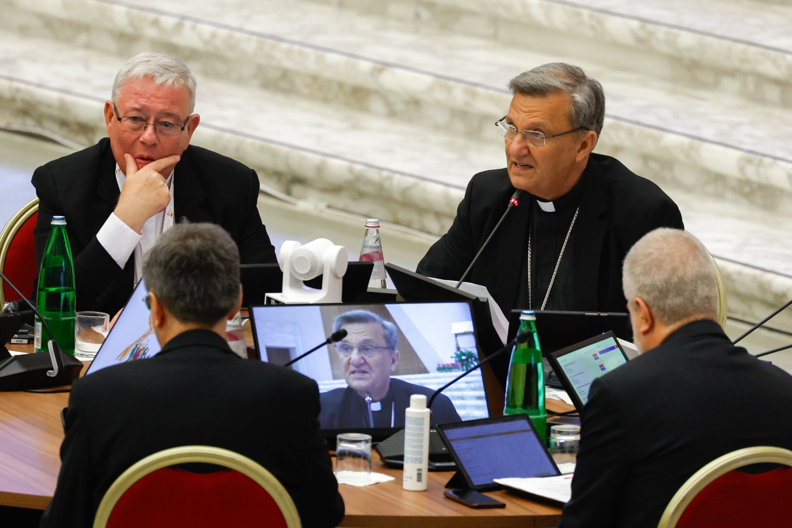 Cardinal Jean-Claude Hollerich, relator general of the synod, listens as Cardinal Mario Grech, secretary-general, introduces the beginning of the assembly of the Synod of Bishops' work in the Vatican's Paul VI Audience Hall Oct. 9, 2023. (CNS photo/Lola Gomez)