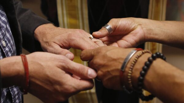 A same-sex couple is pictured in a file photo exchanging rings during a ceremony in Salt Lake City. Pope Francis has indicated an openness to considering with pastoral prudence the subject of blessing same-sex couples, so long as it's clear this is not a sacramental union akin to the sacrament of matrimony. (CNS photo/Jim Urquhar, Reuters)