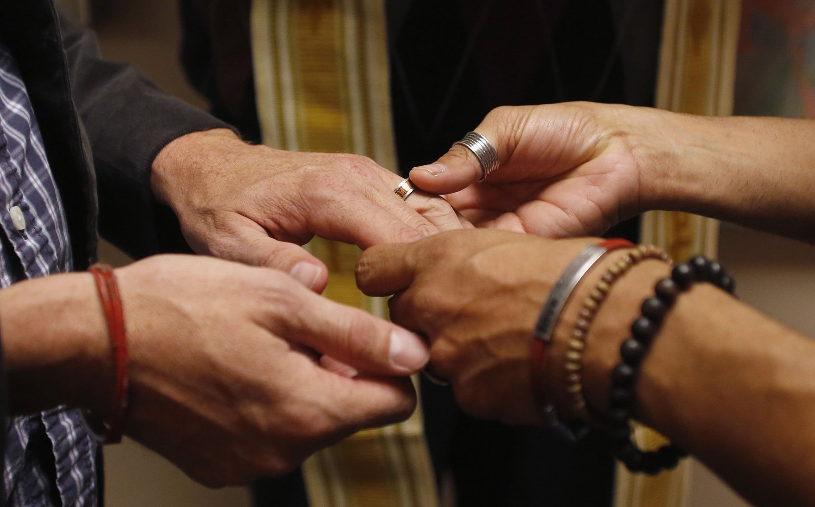 A same-sex couple is pictured in a file photo exchanging rings during a ceremony in Salt Lake City. Pope Francis has indicated an openness to considering with pastoral prudence the subject of blessing same-sex couples, so long as it's clear this is not a sacramental union akin to the sacrament of matrimony. (CNS photo/Jim Urquhar, Reuters)