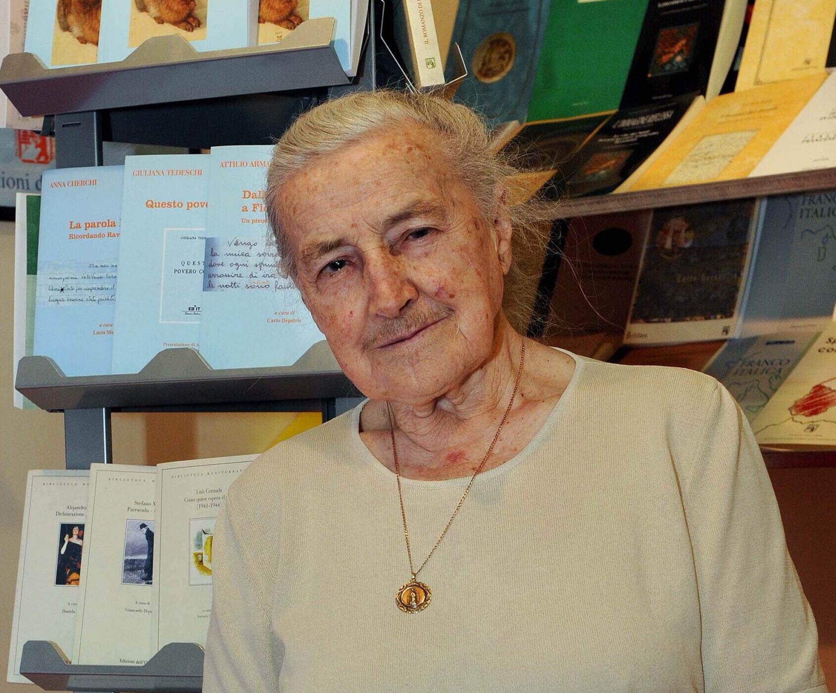 Wanda Póltawska, a longtime friend and soulmate to St. John Paul II, holds a copy of a book she wrote in a bookstore in Turin, Italy, in this May 12, 2008 file photo. Póltawska, a Polish psychiatrist, wife, mother of four and a survivor of Ravensbrück Nazi concentration camp, died Oct. 24, 2023, at 101 in Krakow, Poland. (OSV News photo/Guglielmo Lobera, Catholic Press Photo)