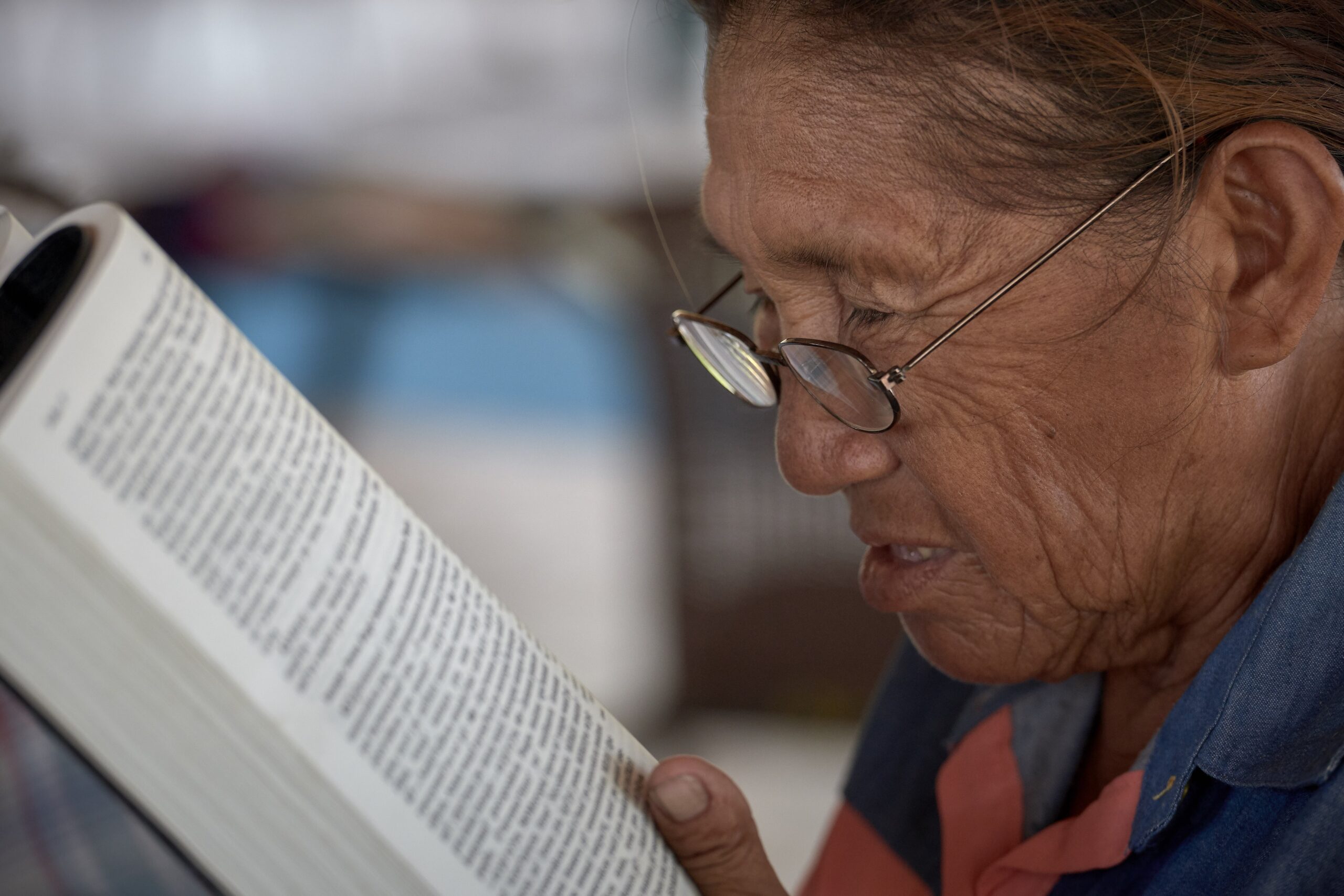 A woman reads the Bible in St. Ignatius, Guyana, April 5, 2019. The country's nine Indigenous peoples make up half of its Catholic population. (CNS photo/Paul Jeffrey)