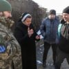 Basilian Sister Lucia Murashko talks with volunteers Denys Kuprikov, left, and Ivan Smyglia, far right, in Zaporizhzhia in southeast Ukraine Feb. 7, 2023, about where they will distribute humanitarian aid along the front in Russia's war against Ukraine. Catholic Extension, a Chicago-based nonprofit, announced Sept. 27 that it has named the Sisters of the Order of St. Basil the Great as the 2023-2024 recipients of its highest honor, the Lumen Christi Award. (OSV News photo/Konstantin Chernichkin, CNEWA)