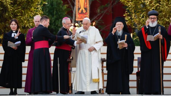 Pope Francis and other Christian leaders give their blessing at the end of an ecumenical prayer vigil in St. Peter's Square Sept. 30, 2023, ahead of the assembly of the Synod of Bishops. From the left are the Rev. Ann Burghardt, general secretary of the Lutheran World Federation, and Anglican Archbishop Justin Welby of Canterbury. To the right of the pope are Orthodox Ecumenical Patriarch Bartholomew of Constantinople and Syriac Orthodox Patriarch Ignatius Aphrem II. (CNS photo/Lola Gomez)