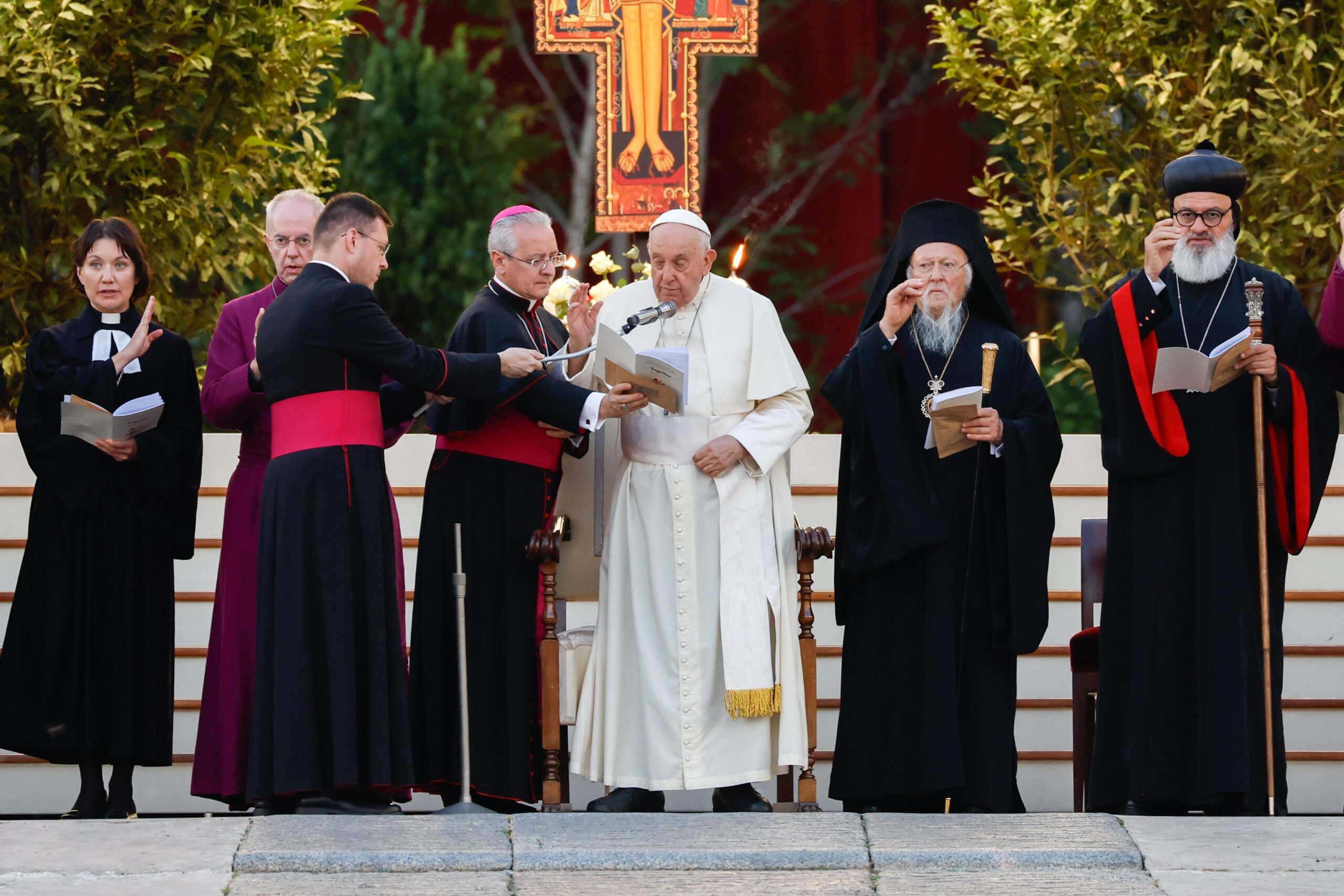 Pope Francis and other Christian leaders give their blessing at the end of an ecumenical prayer vigil in St. Peter's Square Sept. 30, 2023, ahead of the assembly of the Synod of Bishops. From the left are the Rev. Ann Burghardt, general secretary of the Lutheran World Federation, and Anglican Archbishop Justin Welby of Canterbury. To the right of the pope are Orthodox Ecumenical Patriarch Bartholomew of Constantinople and Syriac Orthodox Patriarch Ignatius Aphrem II. (CNS photo/Lola Gomez)