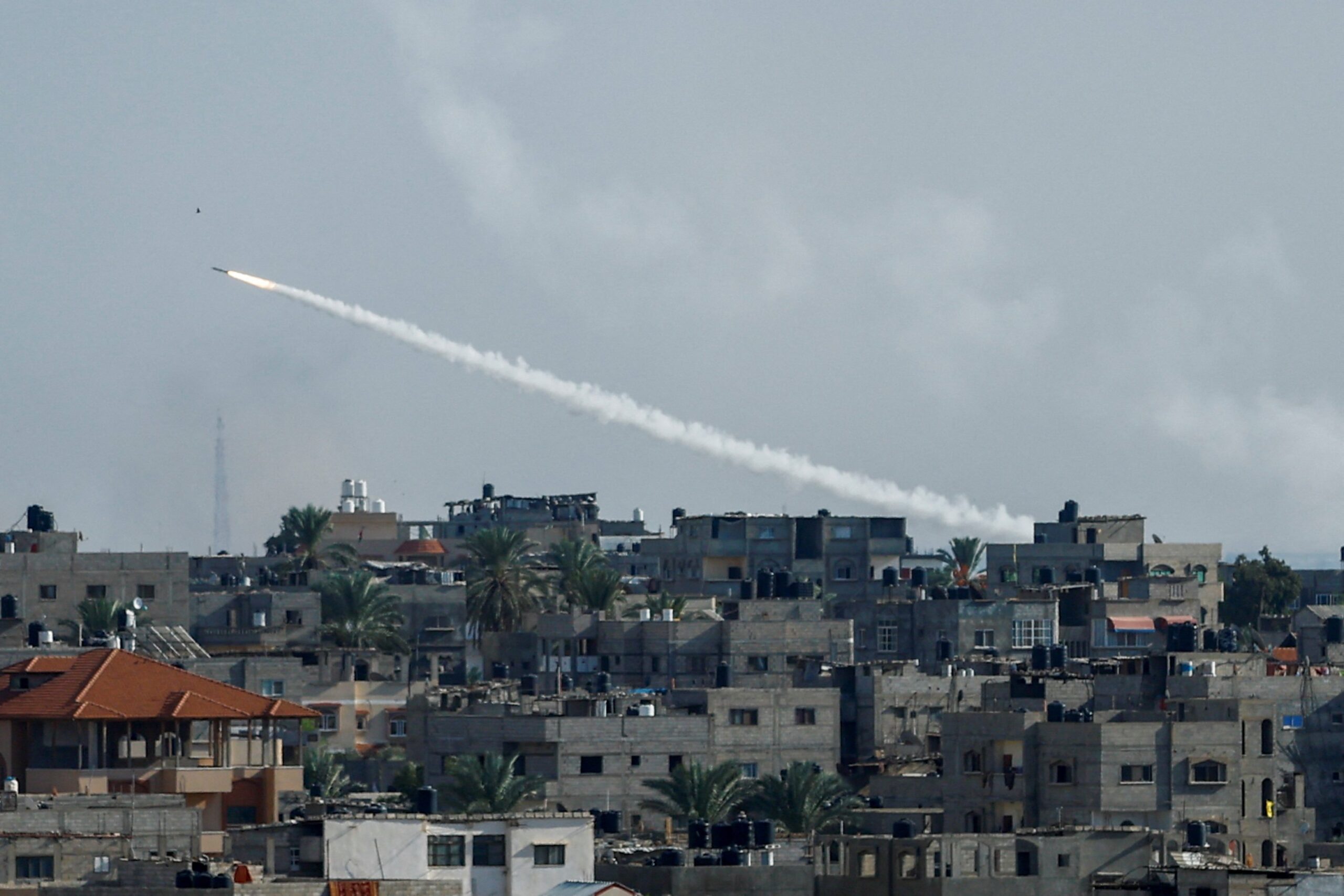 A rocket is fired from Gaza toward Israel, in Gaza, Oct. 7, 2023. Hamas militants breached Israeli security along the Gaza border and sent a barrage of over 2,000 rockets that reached into Jerusalem and Tel Aviv areas, resulting in dozens dead and hundreds injured. (OSV News photo/Ibraheem Abu Mustafa, Reuters)