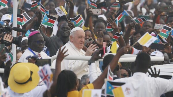 Pope Francis greets the crowd Feb. 5, 2023, as he arrives to celebrate Mass at the John Garang Mausoleum in Juba, South Sudan. (CNS photo/Paul Haring)