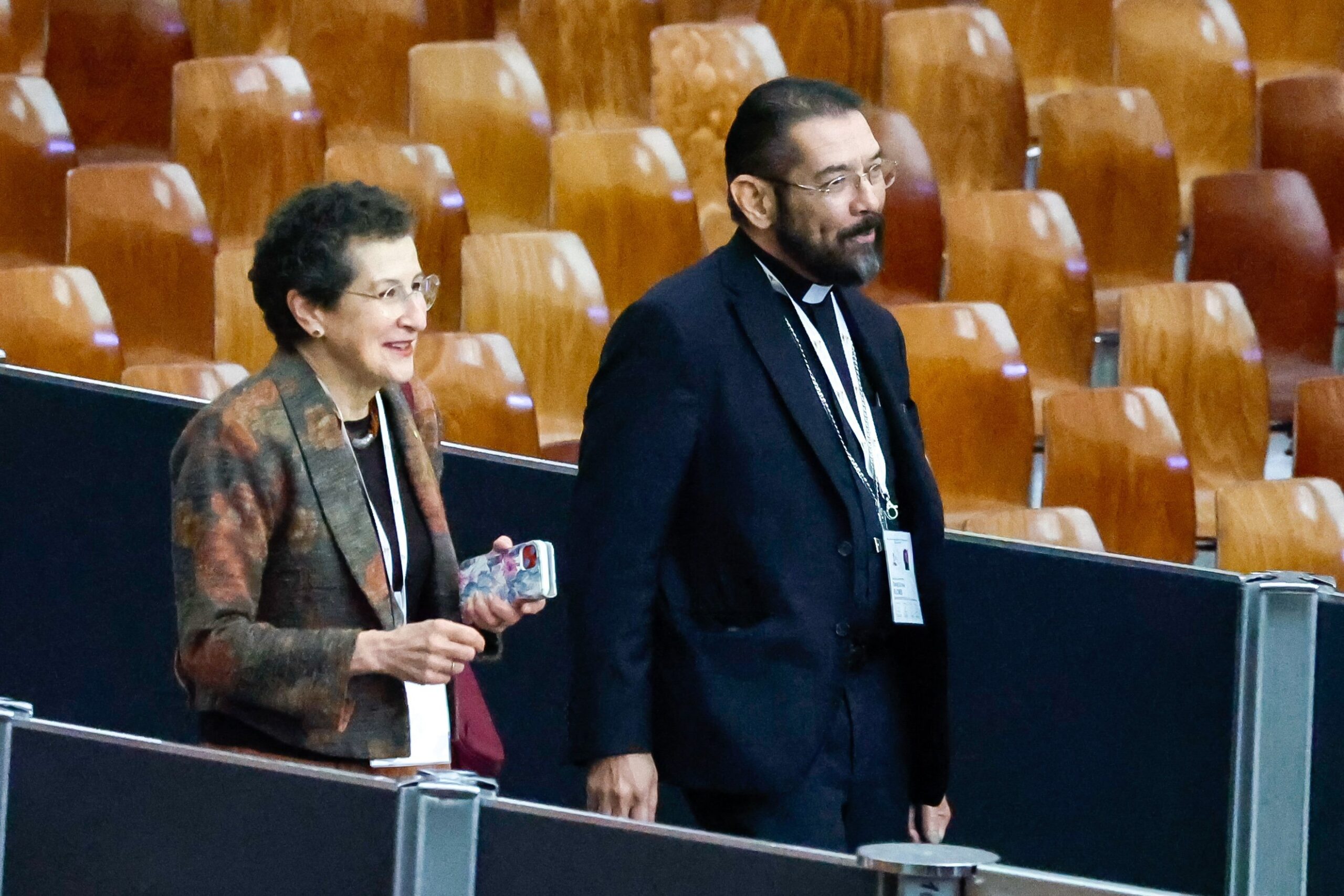 Susan Pascoe, a synod member from Australia, and Bishop Daniel E. Flores of Brownsville, Texas, arrive for a session of the assembly of the Synod of Bishops in the Vatican's Paul VI Audience Hall Oct. 17, 2023. (CNS photo/Lola Gomez)