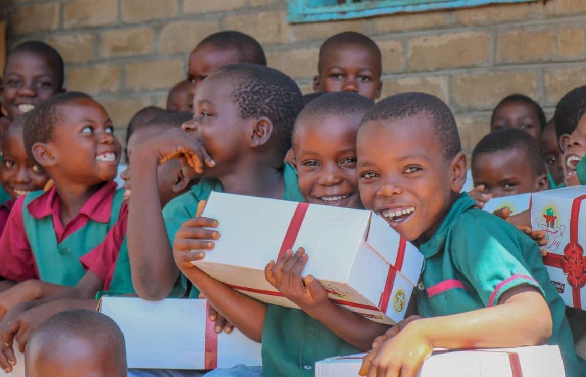 Children in the Diocese of Karonga, Malawi, hold their Box of Joy, an initiative supported by Cross Catholic Outreach, a Florida-based Catholic relief and development organization, in this undated file photo. Over the past 10 years, Cross Catholic Outreach has given more than a half-million children a Box of Joy -- hand-packed gift boxes donated by families, parishes, schools, scout troops, ministries and charitable organizations across the United States. (OSV News photo/courtesy Cross Catholic Outreach)