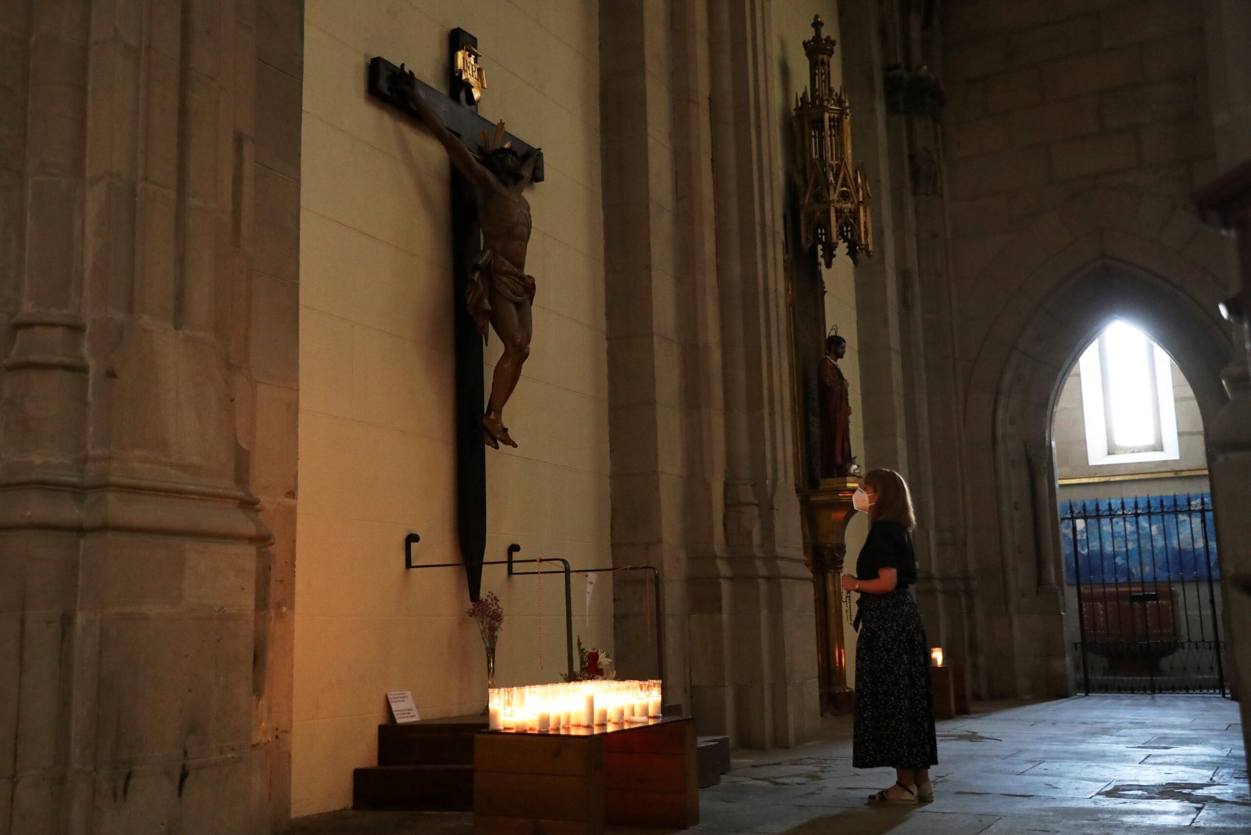 A woman prays inside a church in Lleida, Spain, in this July 13, 2020, file photo. Spanish bishops met Oct. 30, 2023, to discuss Spanish ombudsman Ángel Gabilondo's report on abuse in the Catholic Church delivered Oct. 27. to government officials. (OSV News photo/Nacho Doce, Reuters)