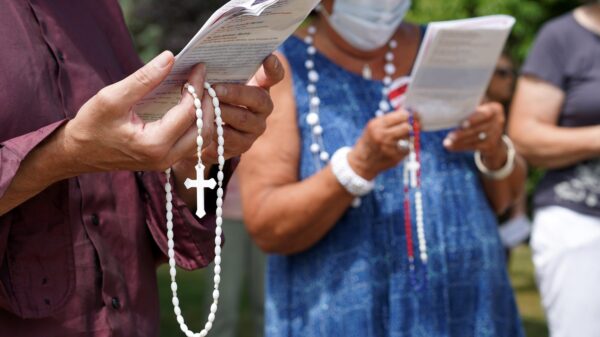 People hold rosaries while participating in a roadside prayer rally marking Religious Freedom Week at St. James Church in Setauket, N.Y., June 24, 2020. (OSV News photo/CNS file, Gregory A. Shemitz)