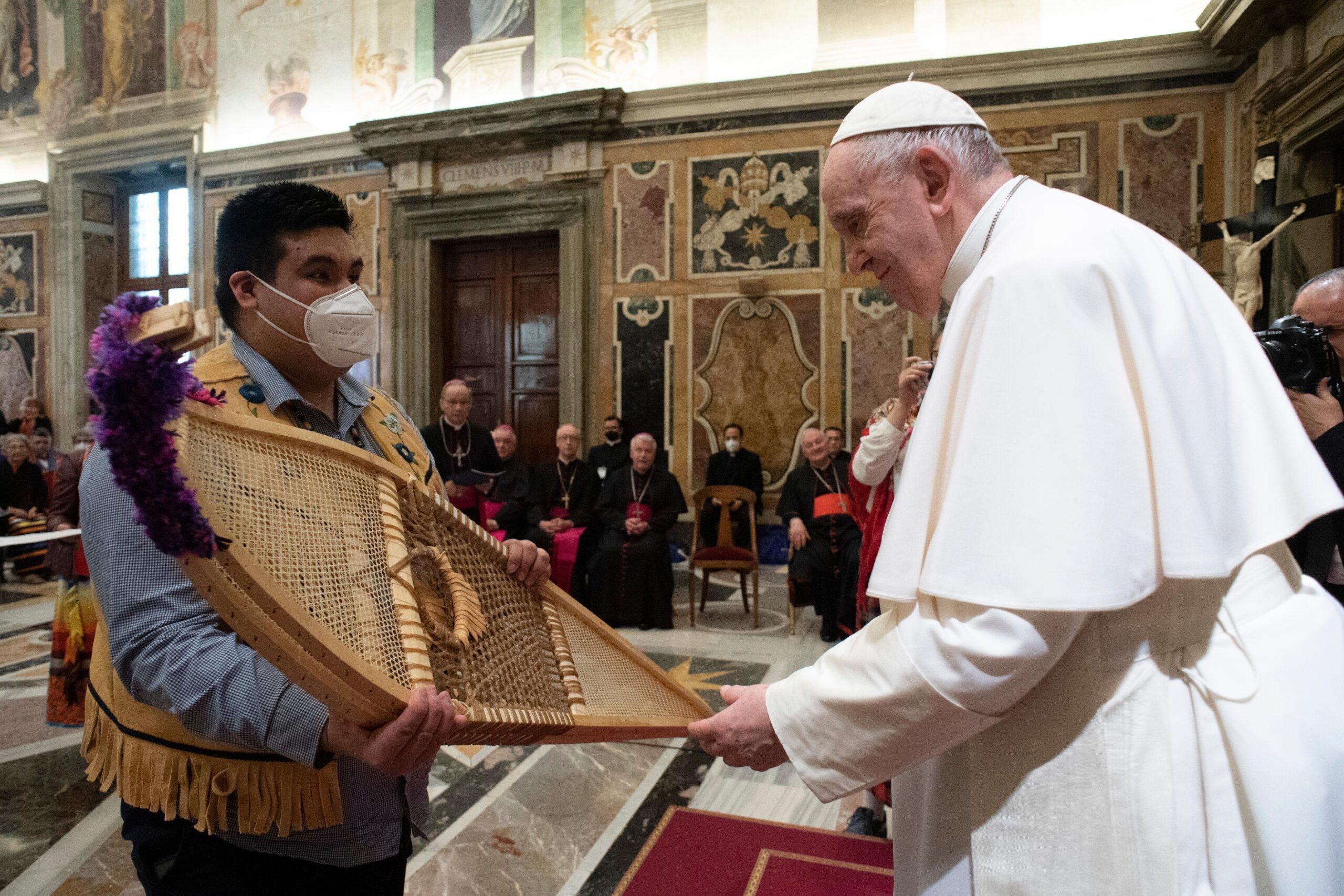 Pope Francis accepts snowshoes from Adrian Gunner, representing the Assembly of First Nations, during a meeting with Canadian Indigenous groups at the Vatican April 1, 2022. (CNS photo/Vatican Media)