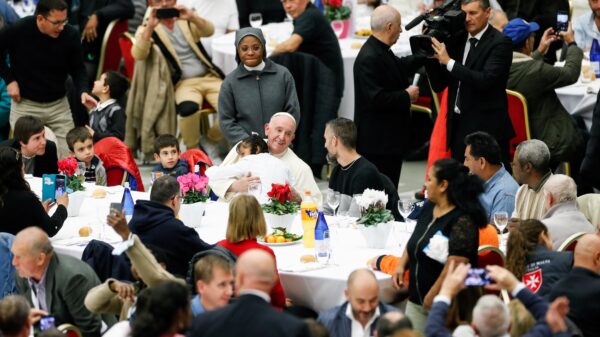 Pope Francis joins some 1,300 guests for lunch in the Vatican audience hall on the World Day of the Poor Nov. 13, 2022. (CNS photo/Remo Casilli, Reuters)
