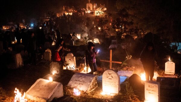 People light candles and burn pine woods as they visit the graves of departed loved ones on All Saints' Day, in Sagada town, Mountain Province, Philippines, Nov. 1, 2023. (OSV News photo/Lisa Marie David, Reuters)