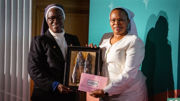 Sister Patricia Ebegbulem, a Sister of St. Louis from Nigeria, receives the Human Dignity Award from Sister Jane Wakahiu, a Little Sister of St. Francis of Assisi, at a London ceremony Oct. 31, 2023. Sister Wakahiu is associate vice president of the Conrad N. Hilton Foundation, a sponsor of the inaugural Sisters Anti-Trafficking Awards along with the Arise foundation and the International Union of Superiors General. (OSV News photo/courtesy Arise foundation)