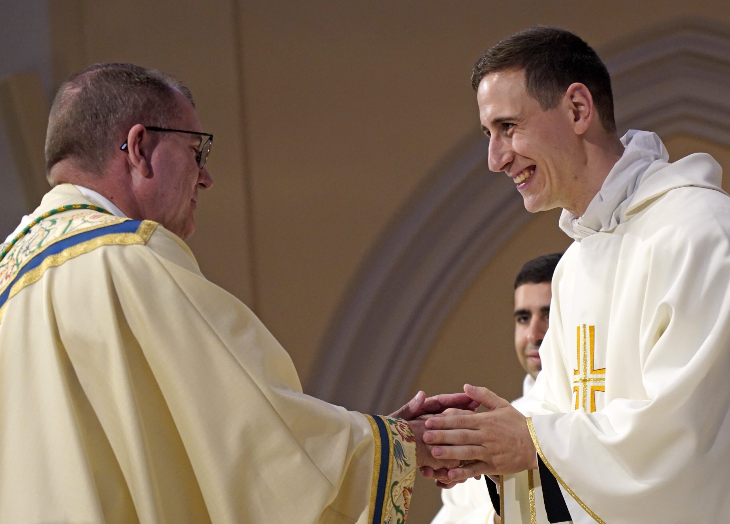 Father Stephen Rooney smiles as he exchanges the sign of peace with Bishop John O. Barres of Rockville Centre, N.Y., during his ordination to the priesthood at St. Agnes Cathedral in Rockville Centre June 18, 2022. (OSV News photo/Gregory A. Shemitz)