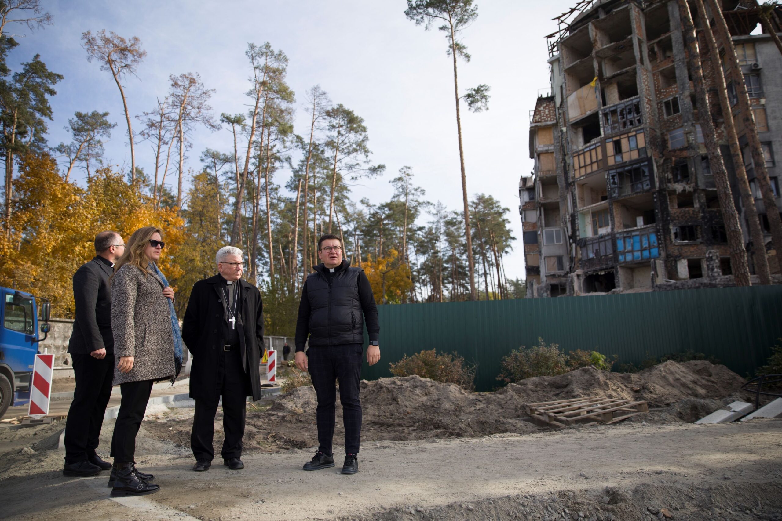 U.S. Bishop Jeffrey M. Monforton, second right, surveys the damage to a residential apartment building in Irpin, a surburb of Kyiv, Ukraine, with representatives of the Ukrainian Greek Catholic Church and Caritas Ukraine during a personal visit to the war-torn nation Oct. 18-22, 2023. Bishop Monforton, former head of the Diocese of Steubenville, Ohio, officially began his ministry as the newest auxiliary bishop of the Archdiocese of Detroit Nov. 7. (OSV News photo/courtesy Ukrainian Greek Catholic Church via Detroit Catholic)