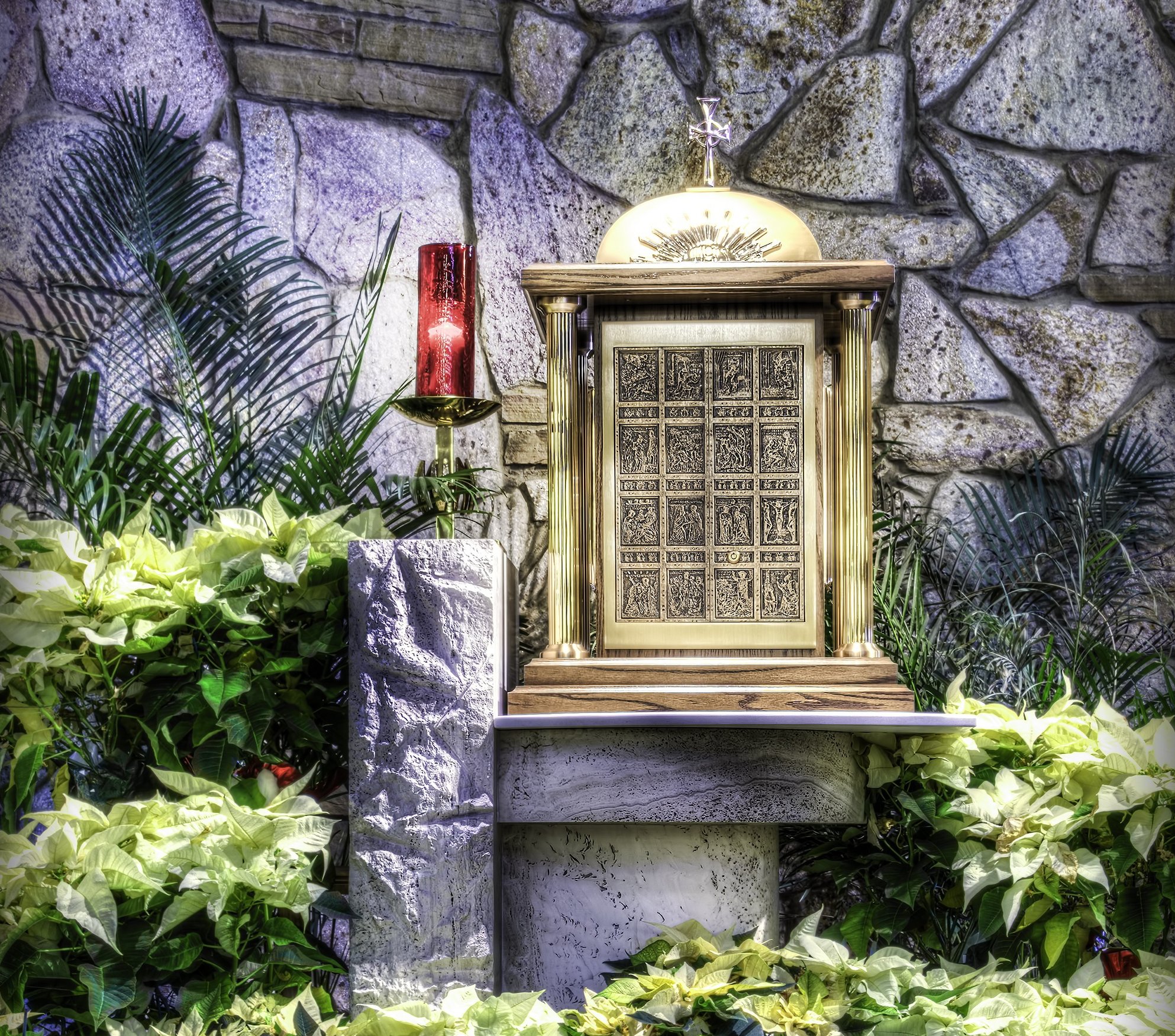 A sanctuary lamp burns beside a tabernacle in this undated photo, indicating that Christ is present in the consecrated hosts within. (OSV News photo/Vincent Ciro, Pixabay)