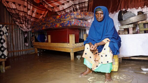 Fatima Abdi, 50, a Somali woman, sits inside her flooded makeshift shelter following heavy rains at the Al Hidaya camp for the internally displaced people on the outskirts of Mogadishu, Somalia, Nov. 6, 2023. Ahead of the COP28 U.N. climate change conference Nov. 30-Dec. 12, Catholic leaders in Africa called for decisive action against climate change, as churches and agencies moved to aid people affected by floods. (OSV News photo/Feisal Omar, Reuters)