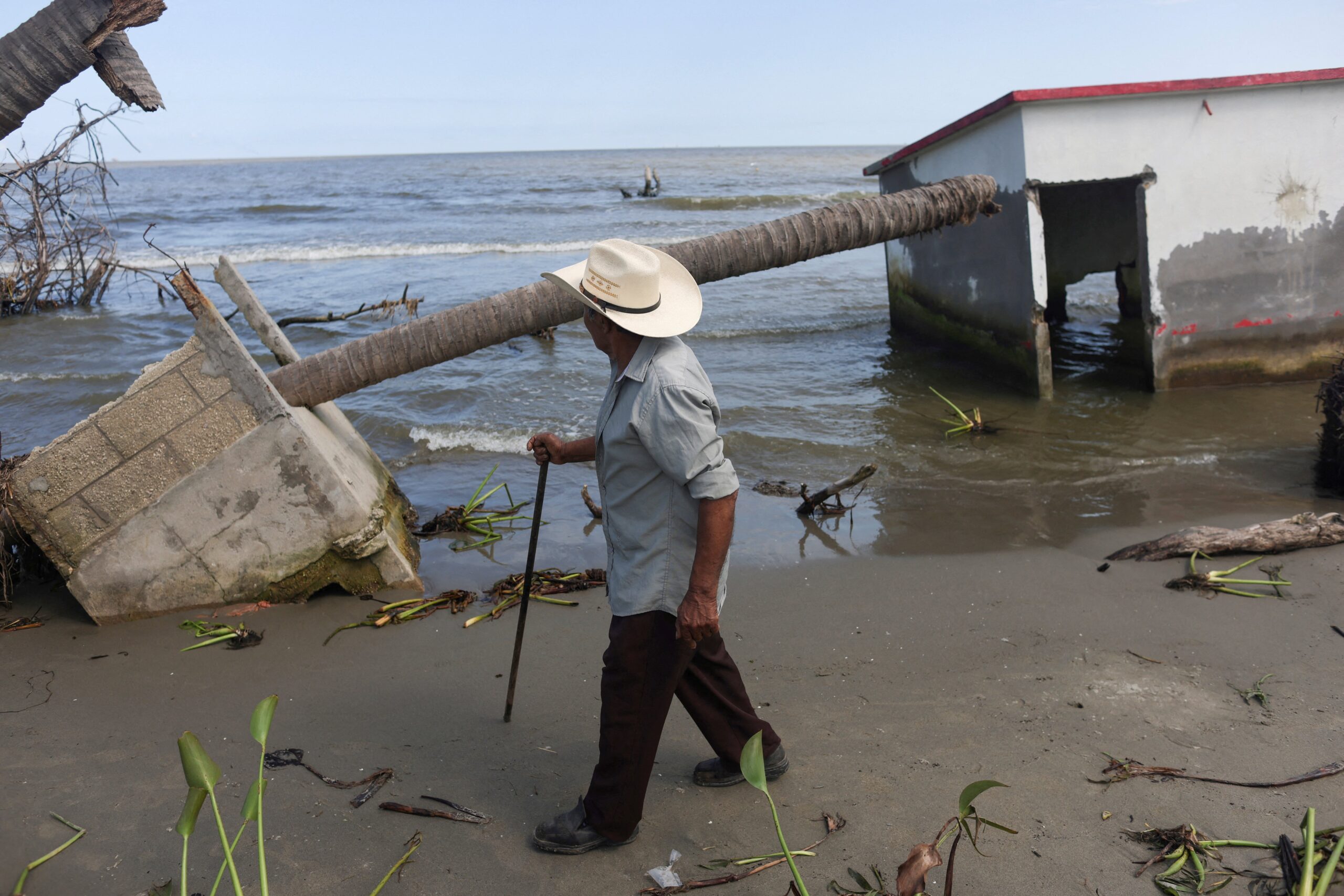 Antonio Mayoral, 76, walks past the place where his house once stood in El Bosque, Mexico, Nov. 7, 2022, amid rising sea levels that are destroying homes built on the shoreline and forcing villagers to relocate. Rising sea levels and other environmental disasters attributed to climate change are the focus of delegates to the United Nations Climate Change Conference, known as COP28, being held Nov. 30 to Dec. 12, 2023, in Dubai, United Arab Emirates. (OSV News photo/Gustavo Graf, Reuters)