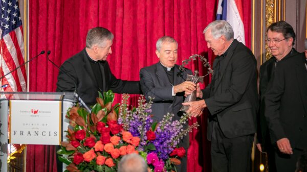 Father Jack Wall, president of Catholic Extension, presents Archbishop Roberto Gonzalez Nieves of San Juan, Puerto Rico, center, with Catholic Extension’s 2023 Spirit of Francis Award in New York City Nov. 28. Also pictured are Cardinals Blase J. Cupich of Chicago, left, and Christophe Pierre, nuncio to the United States. (OSV News photo/courtesy Catholic Extension)
