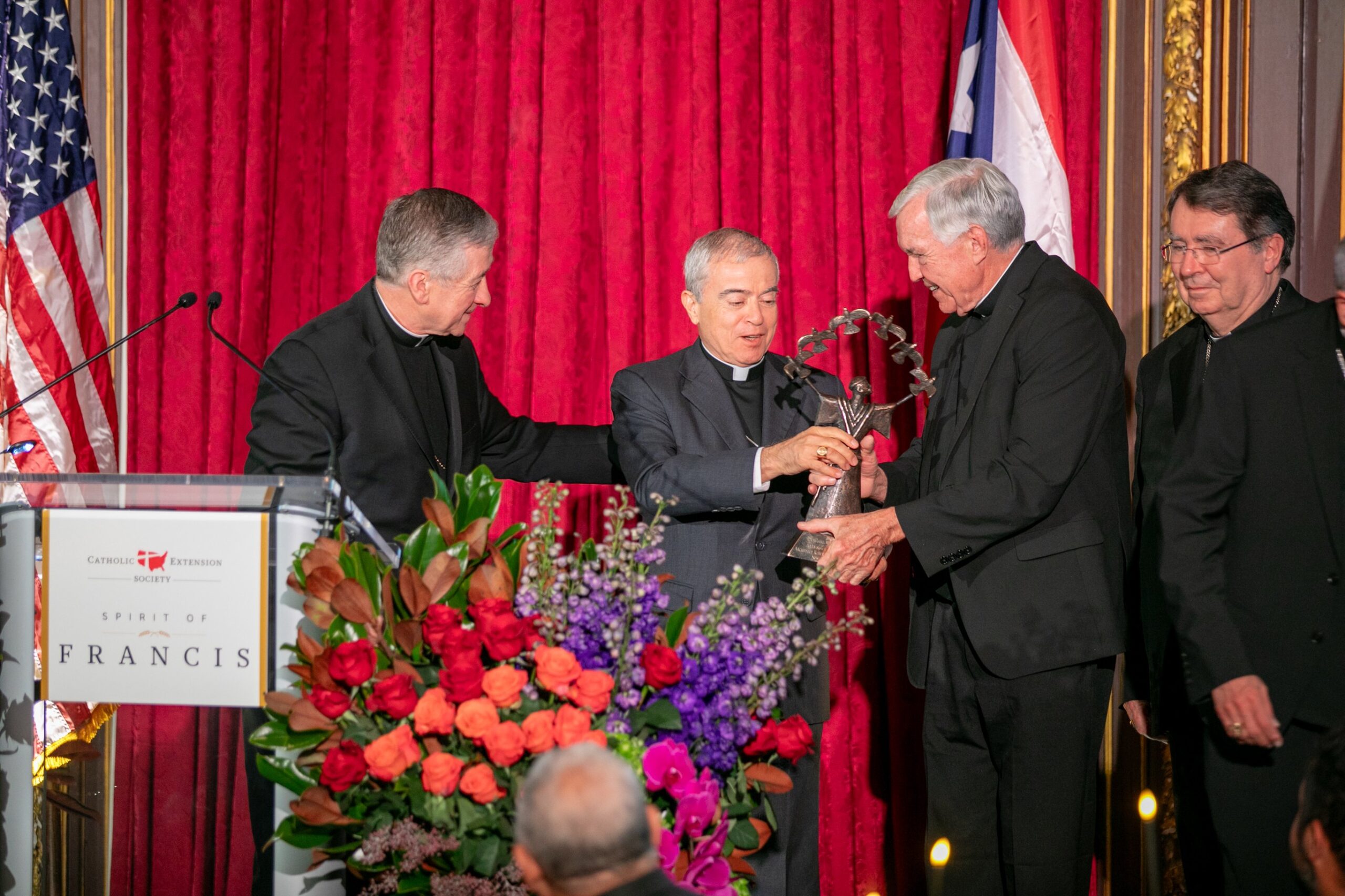 Father Jack Wall, president of Catholic Extension, presents Archbishop Roberto Gonzalez Nieves of San Juan, Puerto Rico, center, with Catholic Extension’s 2023 Spirit of Francis Award in New York City Nov. 28. Also pictured are Cardinals Blase J. Cupich of Chicago, left, and Christophe Pierre, nuncio to the United States. (OSV News photo/courtesy Catholic Extension)