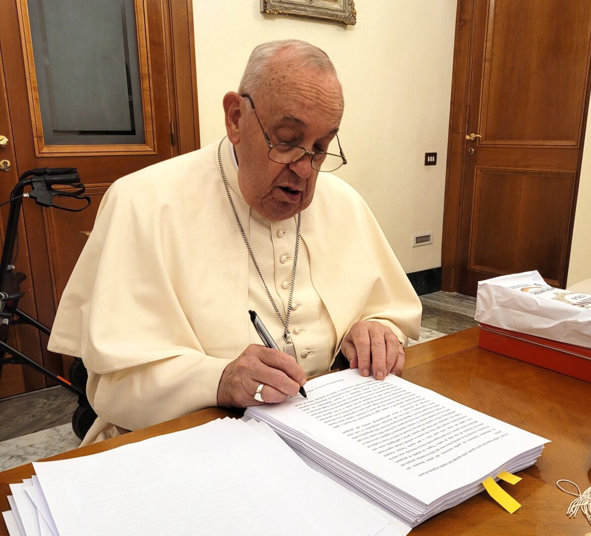 Pope Francis reviews and initials each page of the manuscript of "Hope: The Autobiography" Aug. 9, 2024, in his Vatican residence, the Domus Sanctae Marthae. The book was released in multiple languages Jan. 14, 2025. (CNS photo/courtesy of Mondadori)