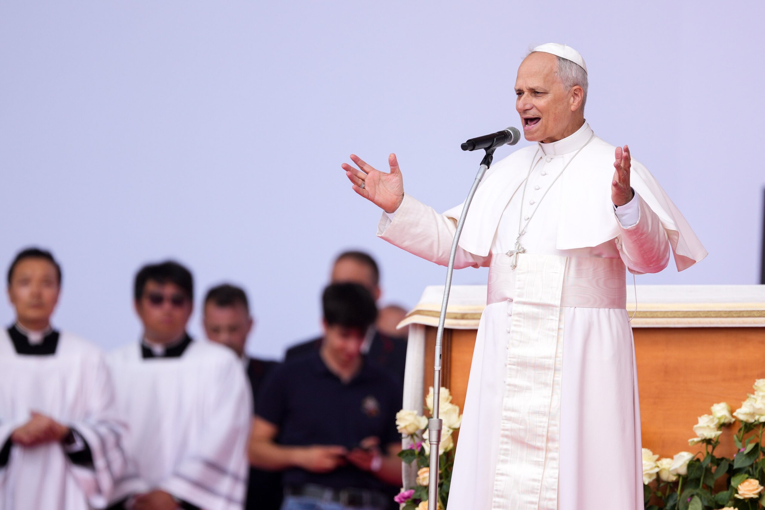Pope Leo stands with...