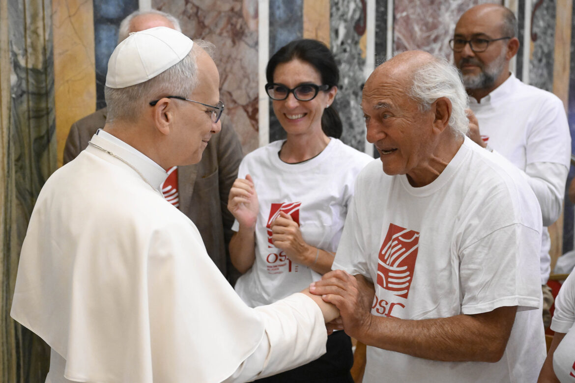 Pope Leo XIV greets a man involved in the Milan-based charity, Opera San Francesco for the Poor, during an audience at the Vatican Sept. 1, 2025. (CNS photo/Vatican Media)