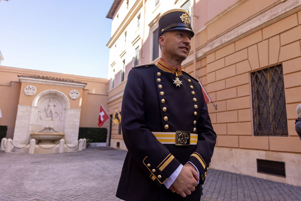 A member of the Pontifical Swiss Guard stands wearing a newly designed uniform, which officers wear to officially represent the corps at formal occasions, during a news conference at the Vatican Oct. 2, 2025. (CNS photo/Pablo Esparza)