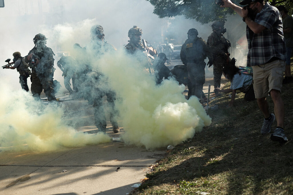 Tear gas rises during a standoff with U.S. Immigration and Customs Enforcement (ICE) and federal officers in the Little Village neighborhood of Chicago Oct. 4, 2025. (OSV News photo/Jim Vondruska, Reuters)