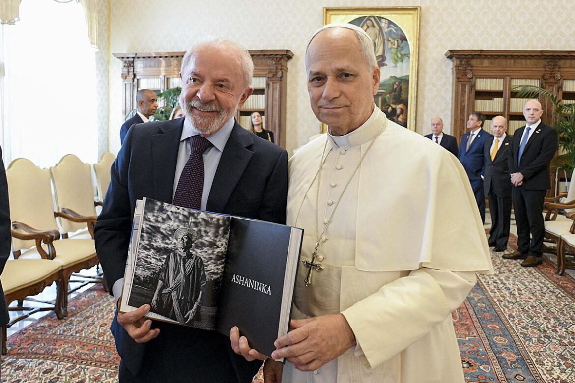 POPE LEO XIV LULA DASILVA Pope Leo XIV meets Brazilian President Luiz Lula da Silva in the library of the Apostolic Palace at the Vatican Oct. 13, 2025. Lula holds a book with a black and white photo representing the Asháninka, an Indigenous people living in the rainforests in Brazil and Peru. (CNS Photo/Vatican Media)
