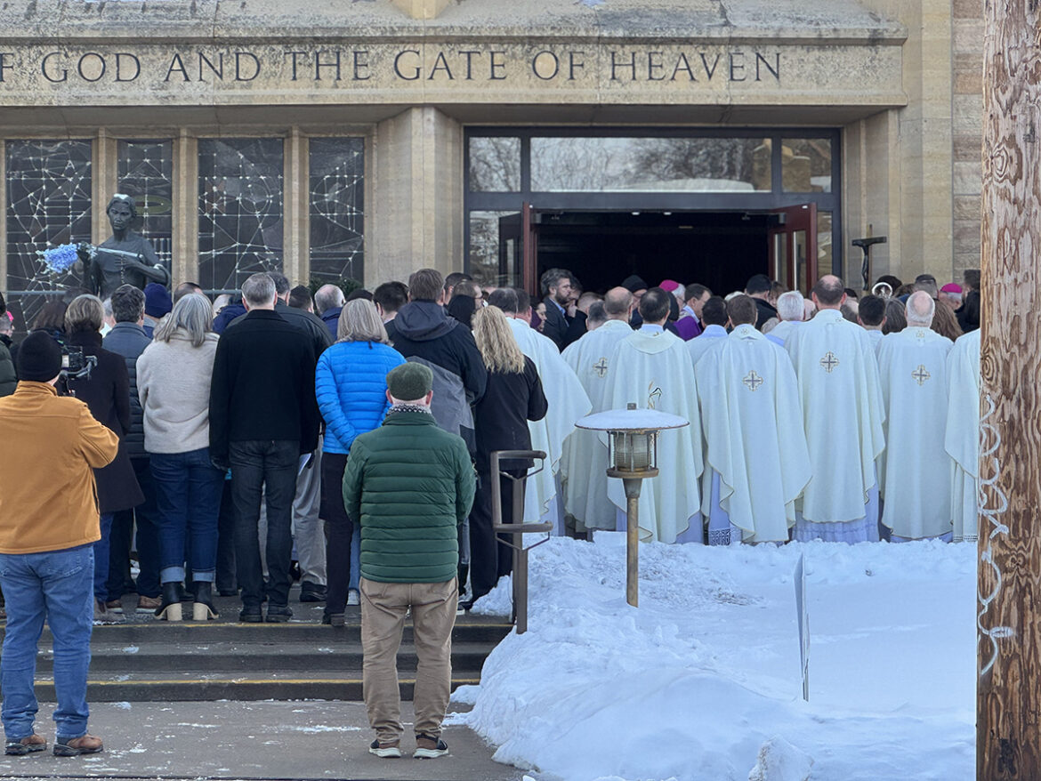 The faithful gather with Archbishop Bernard A. Hebda of St. Paul and Minneapolis and Auxiliary Bishops Kevin T. Kenney and Michael Izen, Father Dennis Zehren, pastor of Annunciation, Father Tom Margevicius, master of ceremonies, and Deacons Kevin Conneely and Eric Cooley in front of the main doors to Annunciation Catholic Church in Minneapolis Dec. 6, 2025, for the "Rite of Reparation After the Desecration of a Church." (OSV News photo/Joe Ruff, The Catholic Spirit)