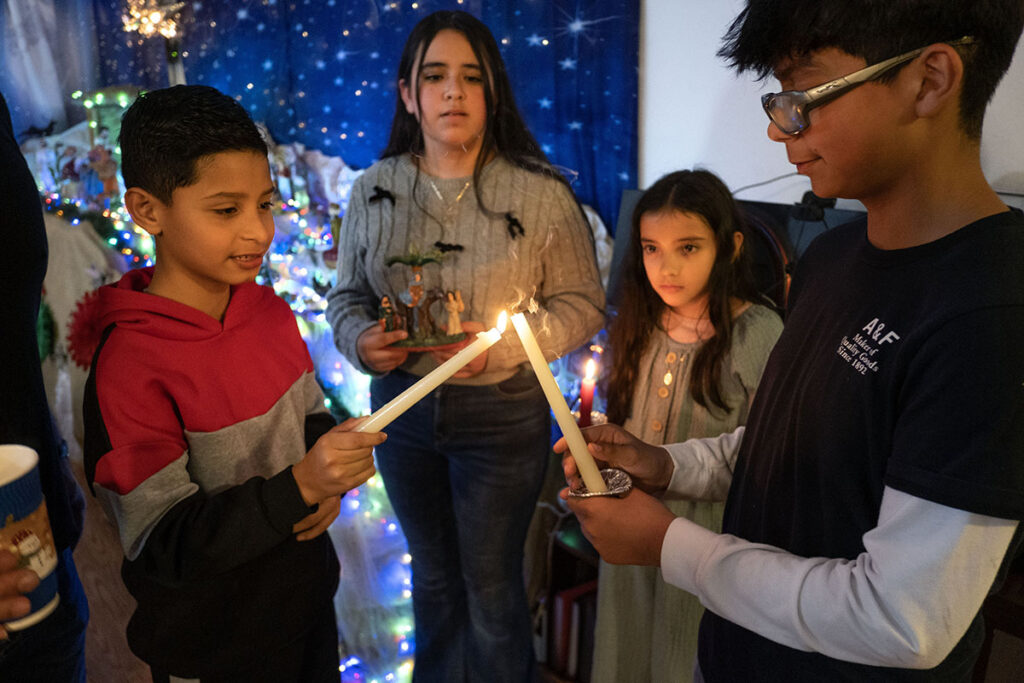 Children light a candle at a traditional Christmas posada in San Jose, Calif., Dec. 21, 2024. Las Posadas is widely celebrated in the U.S., Mexico and other areas of Latin America to reenact Joseph and Mary's search for shelter on the eve of Christ's birth. Those holding the San Jose posada are immigrants from Mexico who have been celebrating posadas for over 25 years since coming to the United States. (OSV News photo/David Maung)