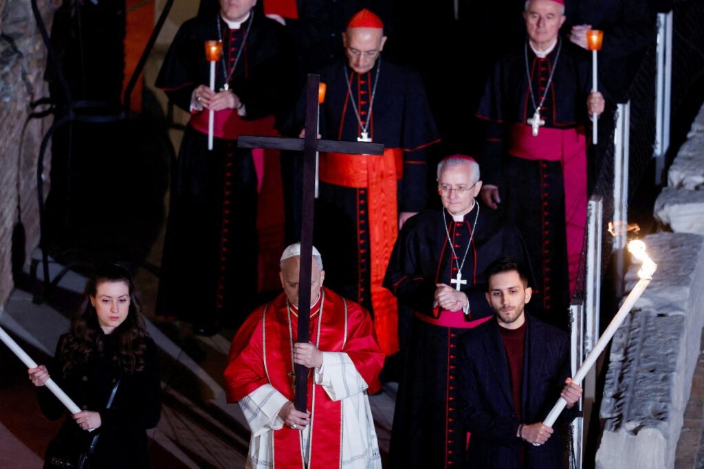At Colosseum, pope carries the cross, leading thousands in Good Friday prayer for suffering world