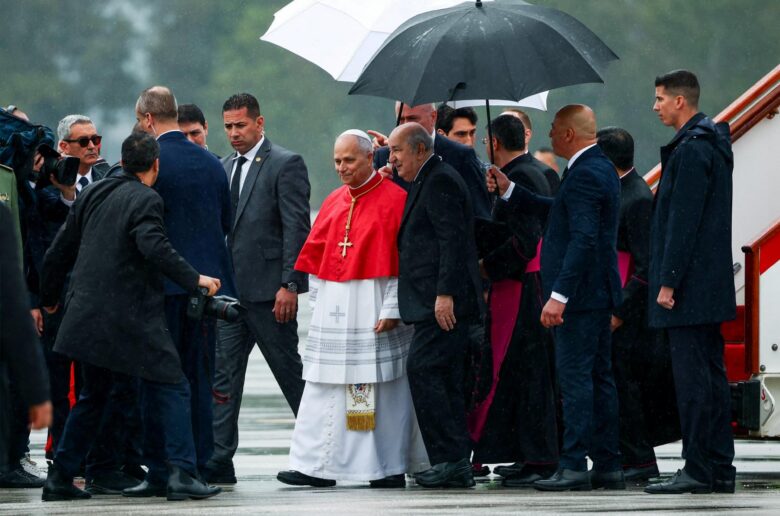 Pope Leo XIV walks on the tarmac with Algerian President Abdelmadjid Tebboune upon arrival at Houari Boumediene International Airport to begin his apostolic journey to Algeria, Angola, Cameroon and Equatorial Guinea, in Dar El Beida, Algiers, Algeria, April 13, 2026. (OSV News photo/Guglielmo Mangiapane, Reuters)