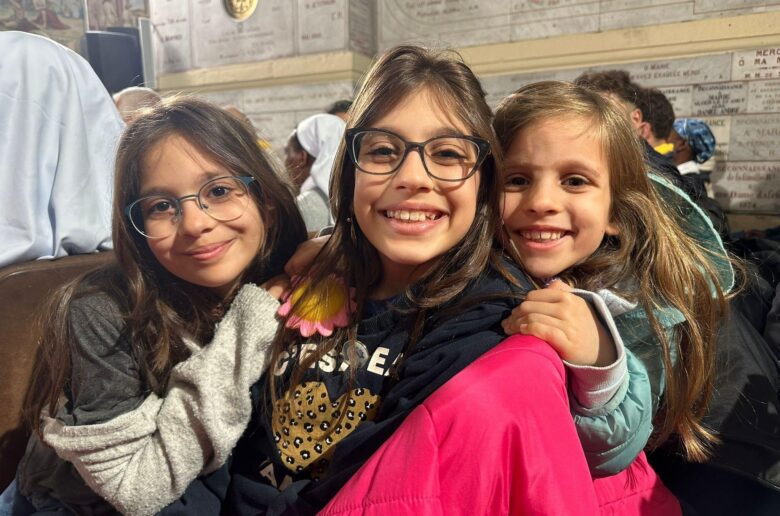 Sisters Mia, Kelly and Cindy wait for Pope Leo XIV's April 13, 2026, meeting with the Algerian community at the Basilica of Our Lady of Africa in Algiers, Algeria. Kelly, 12, said that “Jesus is the best part” of being Catholic. (OSV News photo/Courtney Mares)