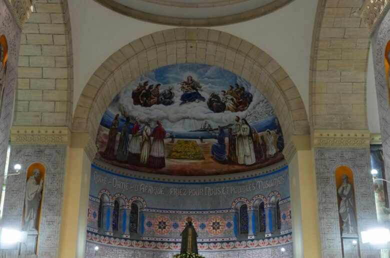 Pope Leo XIV meets with the Algerian Catholic community at the Basilica of Our Lady of Africa in Algiers, Algeria, April 13, 2026. Cardinal Jean-Paul Vesco of Algiers offers his greetings. (CNS photo/Lola Gomez)