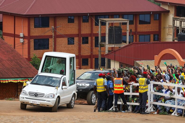 People react outside St. Joseph's Cathedral in Bamenda, Cameroon, April 16, 2026, as Pope Leo XIV arrives for a Meeting for Peace. (OSV News photo/Guglielmo Mangiapane, Reuters)