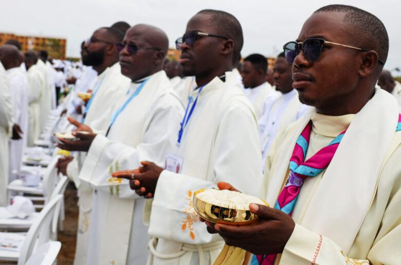 Members of the clergy hold vessels containing the Eucharist as Pope Leo XIV leads a holy Mass during his apostolic journey to Africa in Kilamba, Angola, April 19, 2026. (OSV News photo/Cesar Muginga, Reuters)