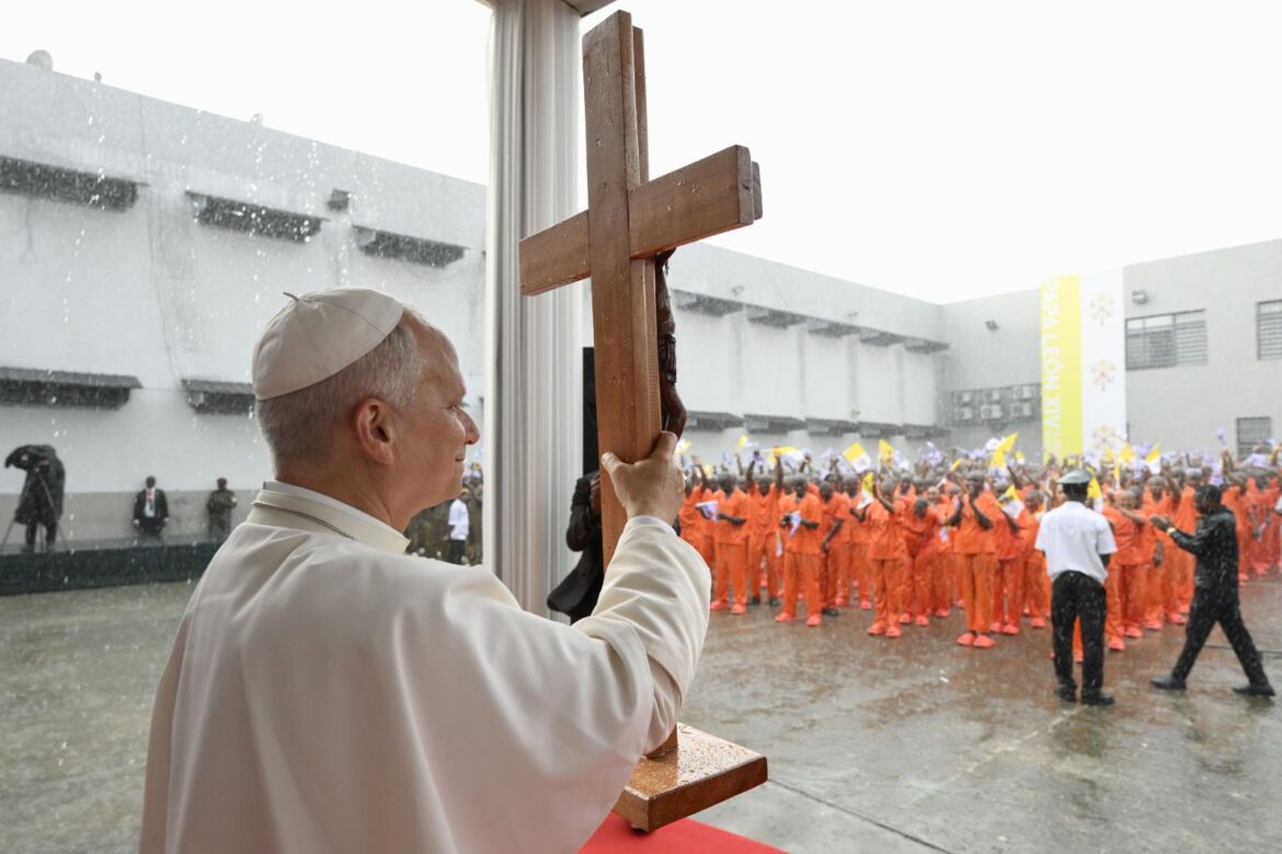 Pope Leo XIV holds a cross during a visit to Bata prison in Equatorial Guinea, April 22, 2026. (OSV News photo/Simone Risoluti, Vatican Media)