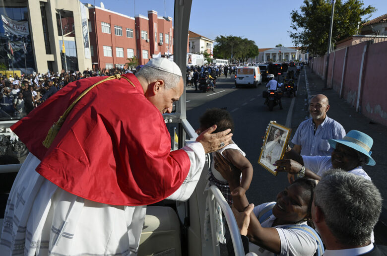 Pope Leo XIV greets a child as he travels in Luanda, Angola, during his apostolic journey in the country April 18, 2026. (OSV News photo/Simone Risoluti, Vatican Media)
