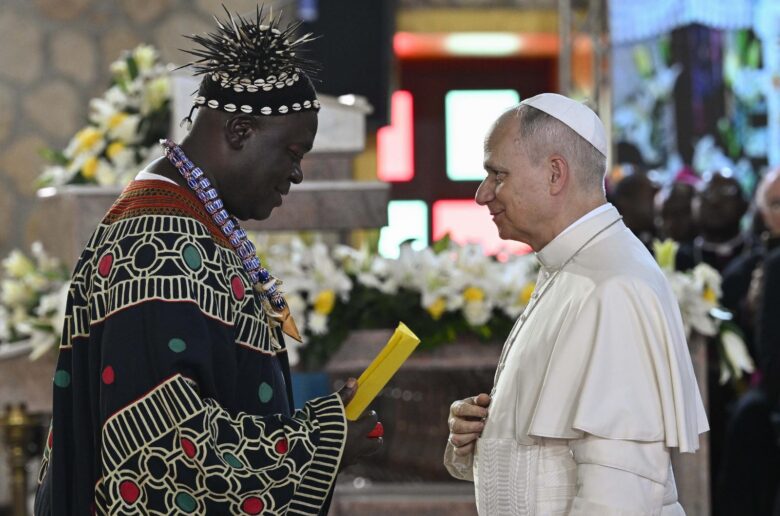 Pope Leo XIV is greeted by a community member as he attends a Meeting for Peace at St. Joseph's Cathedral in Bamenda, Cameroon, April 16, 2026. (OSV News photo/Simone Risoluti, Vatican Media)