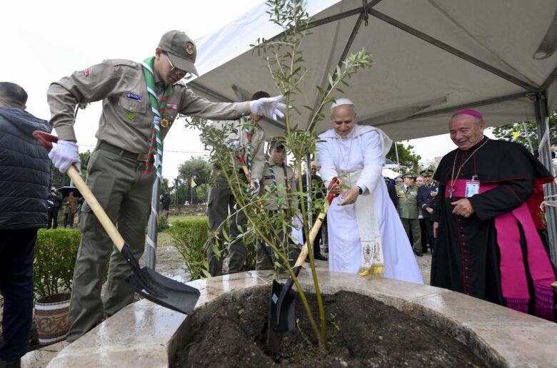 Pope Leo XIV is assisted by a Boy Scout as he visits the archaeological site of Hippo Regius in Annaba, Algeria, April 14, 2026. (OSV News photo/Simone Risoluti, Vatican Media)